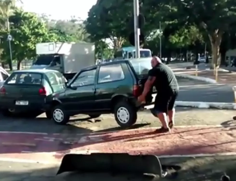 Infuriated Cyclist Picks Up And Moves Parked Car [VIDEO]