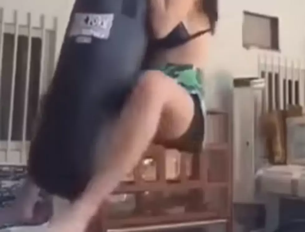 Bad Outcome When Woman Attempts To Swing On Punching Bag [VIDEO]
