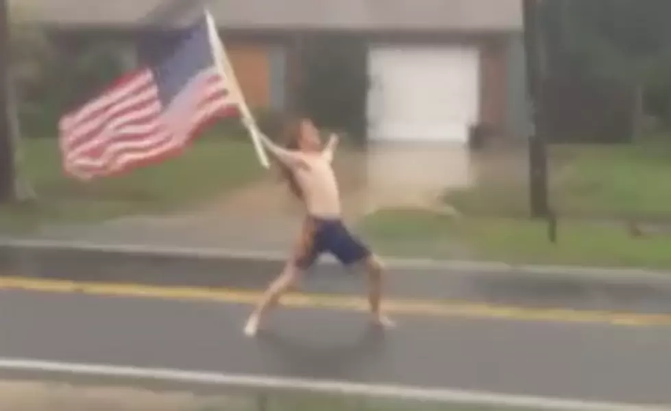 Guy Rocks Out To Slayer Holding An American Flag In The Middle Of Hurricane Matthew [VIDEO]