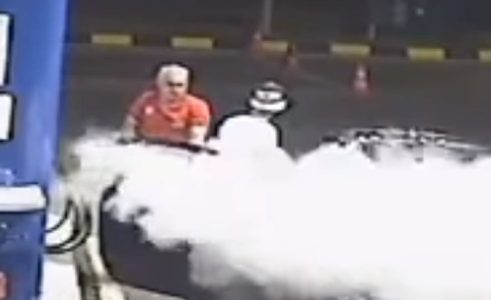 Clueless Idiot Gets Sprayed by a Fire Extinguisher While Smoking at the Pump [VIDEO]