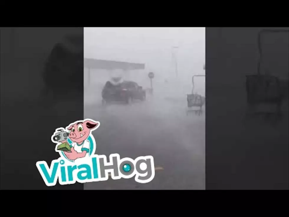 Elderly Woman Fights Through a Rainstorm to Return Shopping Cart [VIDEO]