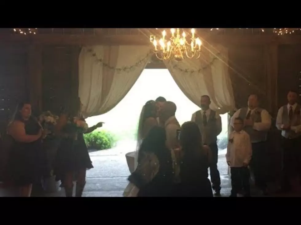Wedding Photographer Shoves Bride’s Step-Mom Out of the Way [VIDEO]