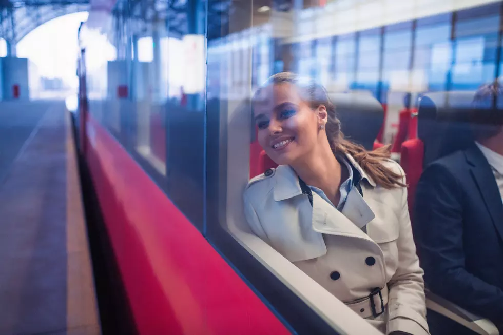 Smiling woman in a train