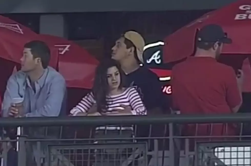 Guy Too Busy Feeling Up Girlfriend to Watch Atlanta Braves Game [VIDEO]