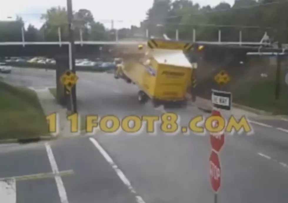 You’ll Love Watching Over 4 Minutes of Trucks Running Into a Bridge [VIDEO]