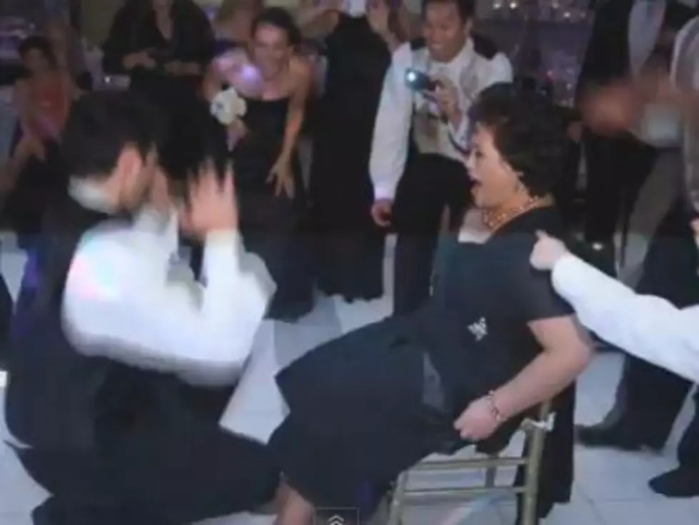 Watch a Groom Get Tricked Into Taking a Garter Belt Off His Own Mother