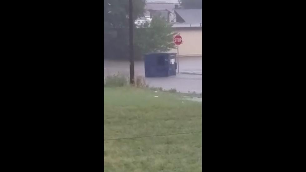 Dumpsters Float Down Flooded Lubbock Street, Ignoring Stop Signs [Video]