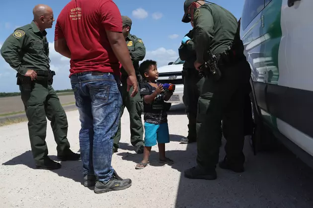 Human Smugglers Drop 2 Toddlers Over 14-Foot Border Fence