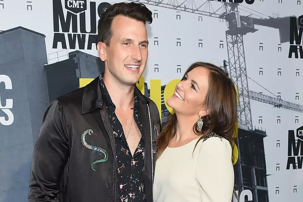 Russell Dickerson Plants One on His Wife to Celebrate Last Show of 2018