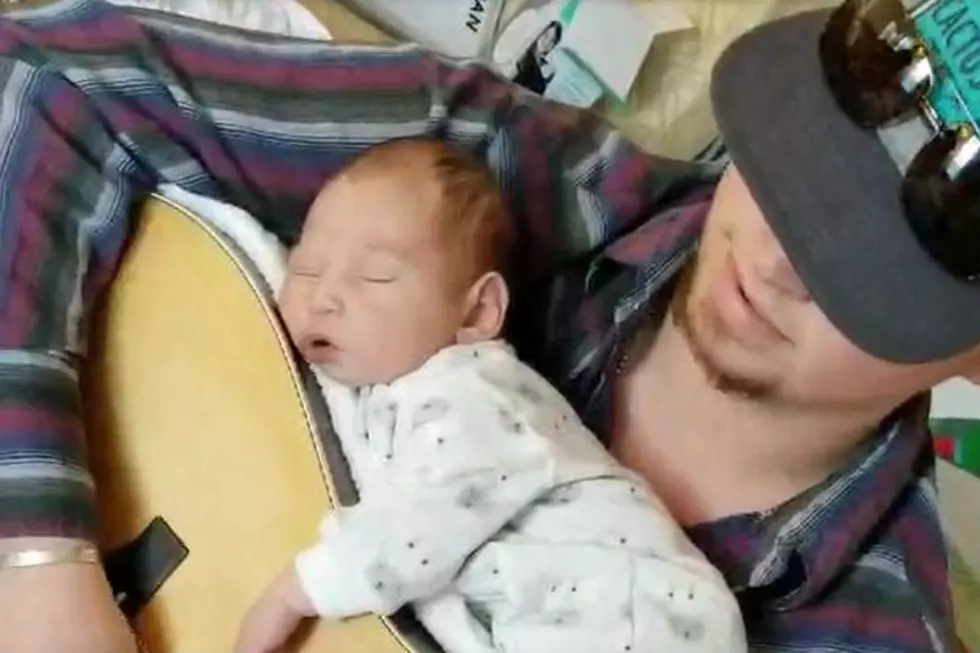 Country Daddy Does It His Way, Gets Newborn to Sleep on Top of Guitar [Watch]