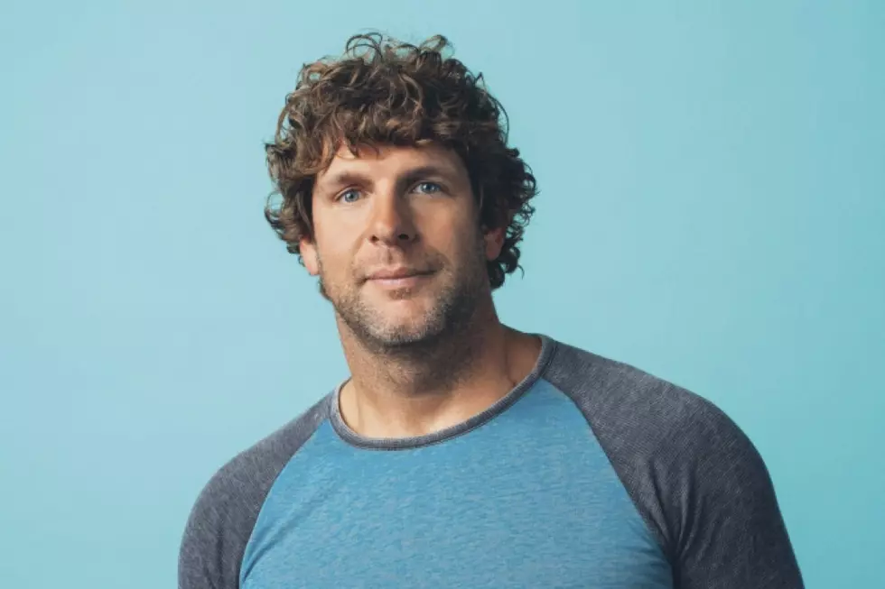 takes a soothing dip in the ocean with Billy Currington