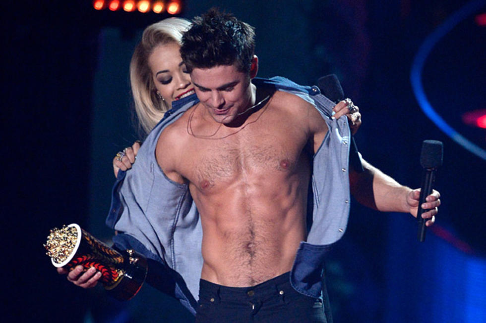 Zac Efron Talks Rita Ora Ripping His Shirt Off, She Compares His Chest to a ‘Chicken’s Thigh’ [VIDEO]