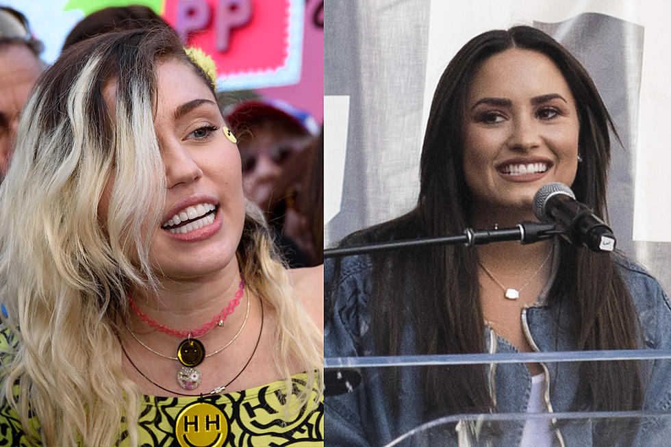 Miley Cyrus and Demi Lovato’s Awkward Reunion at Women’s March Goes Viral