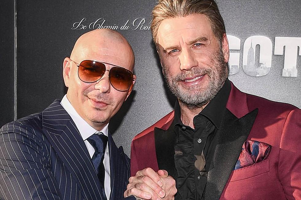 John Travolta Shaved His Head Because Bald Icon Pitbull Told Him To