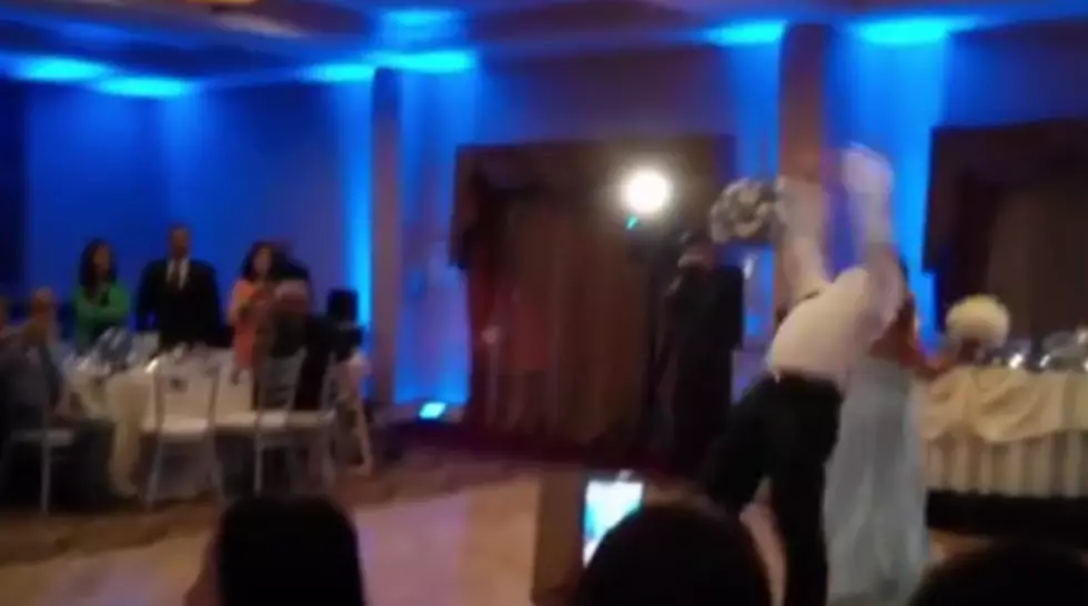 Epic Wedding Fail! Groomsman Knocks Out Bridesmaid With Backflip [Video]