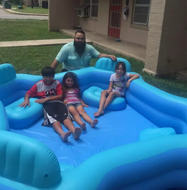 Guy Sees Kids Bathing In Pickup Truck Bed, Buys Them A Pool