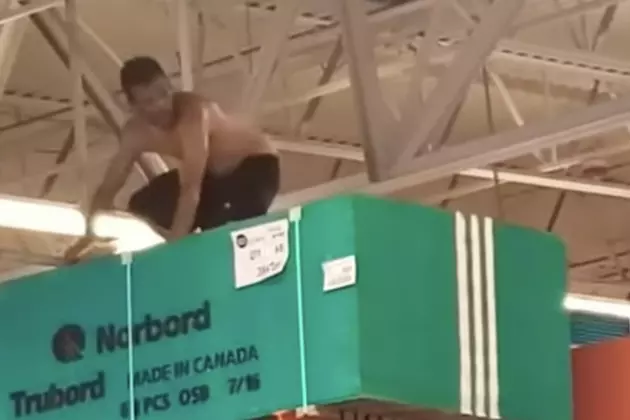Guy Climbs to the Top of Home Depot—Blown Away by Sprinkler System
