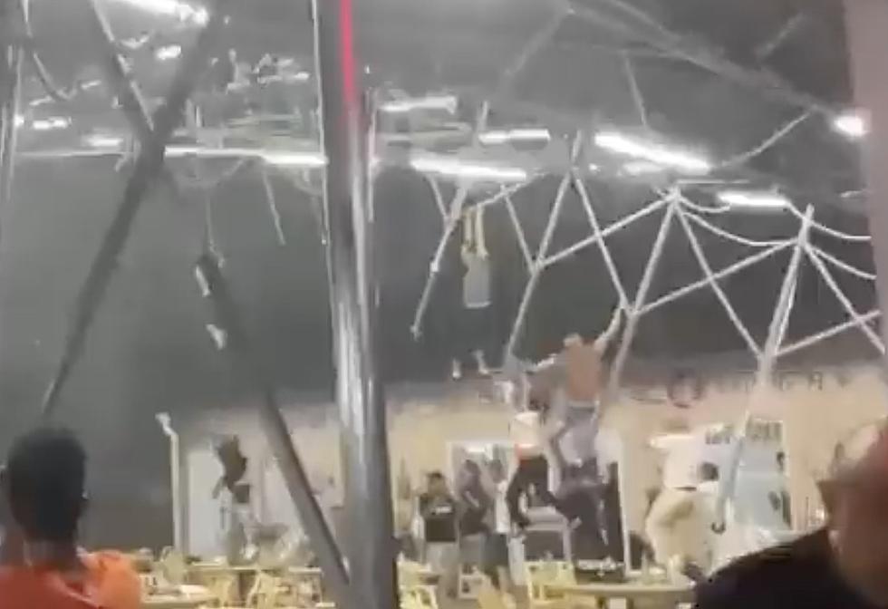 Several People Blown Into Air When Canopy Goes Flying [WATCH]