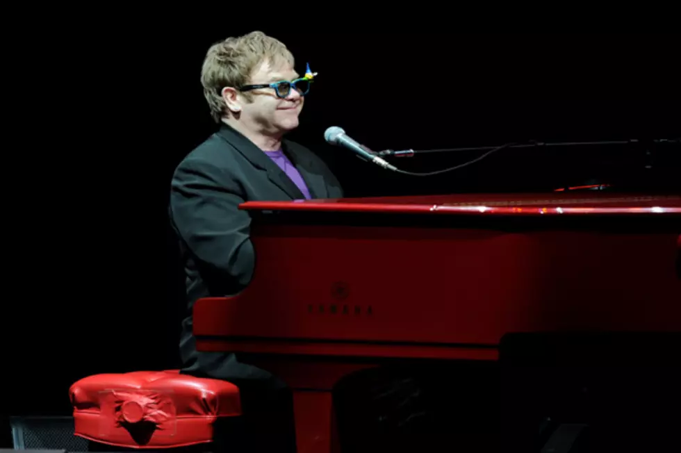 Elton John Signs Book Deal