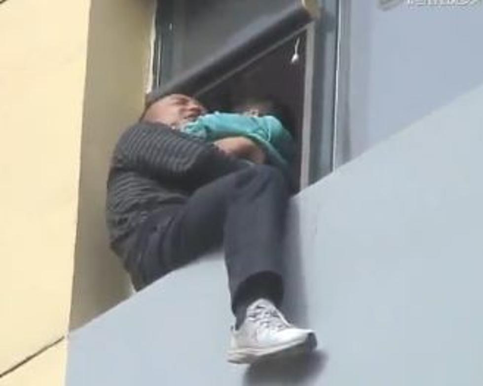 Amazing Rescue – Suicidal Man Holding Baby Is Kicked Back To Safety [Video]