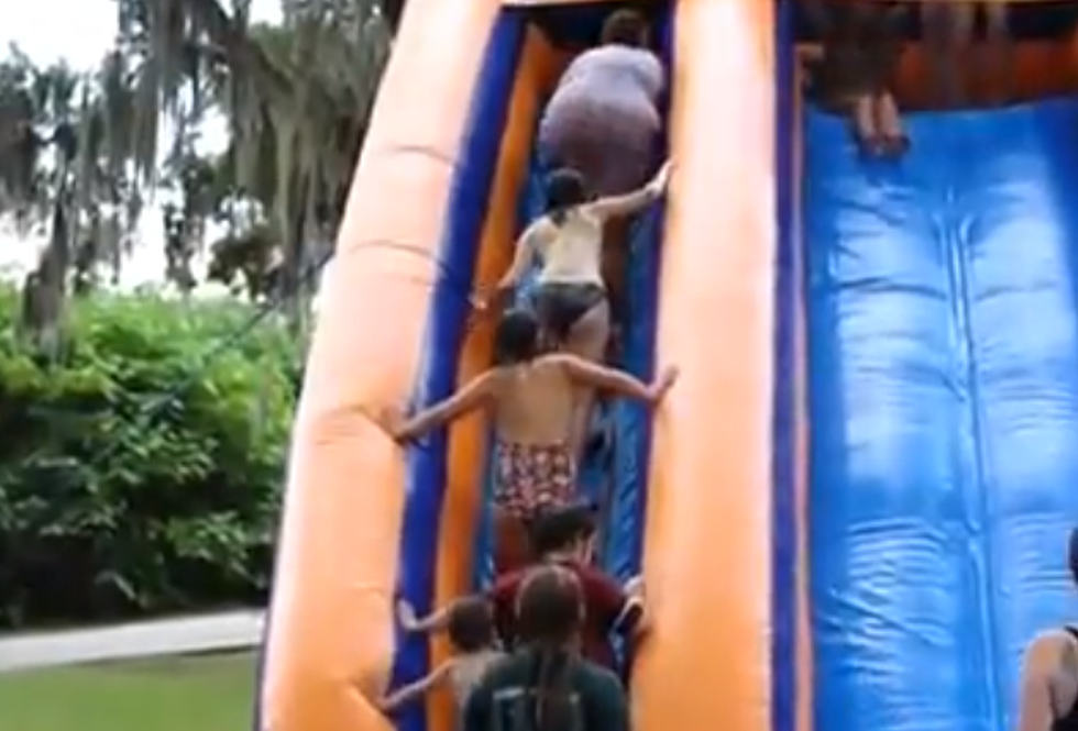 Woman Falls Down Water Slide Steps, Wipes Out Line Of Kids [VIDEO]