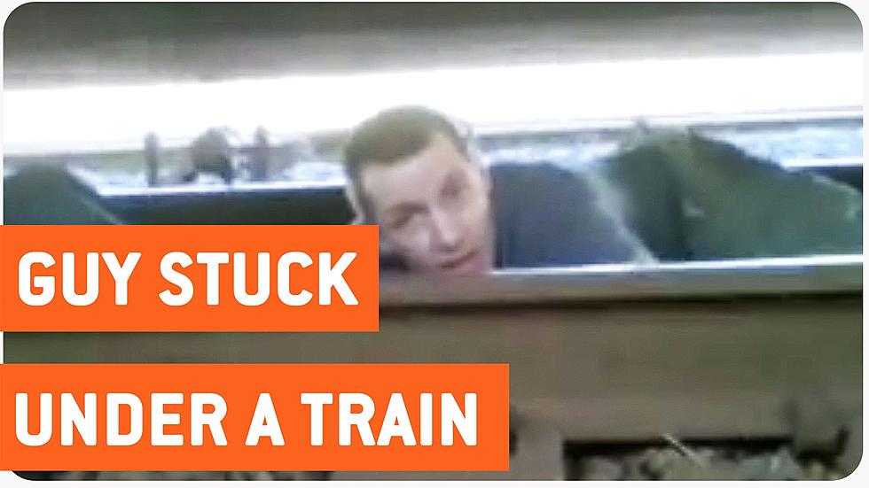 Young Man Stuck Under Moving Train Makes Shocking Escape [VIDEO]