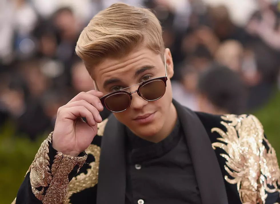 Justin Bieber Tosses Gift Fan Gave Him From Car Window [VIDEO]