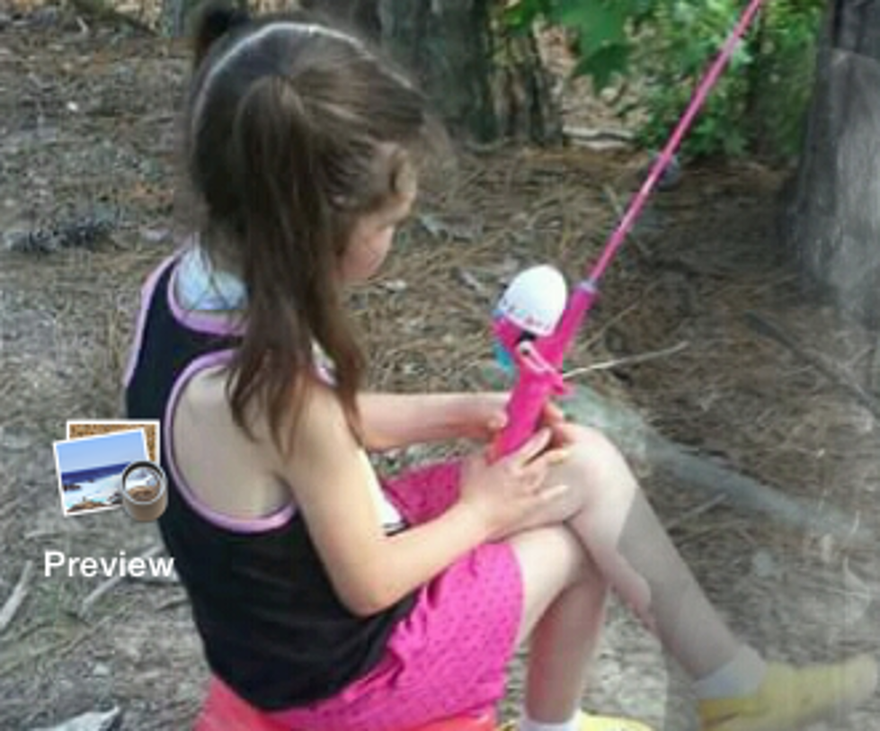 Ghost Appears In Photo While Girl Fishes [PHOTO]