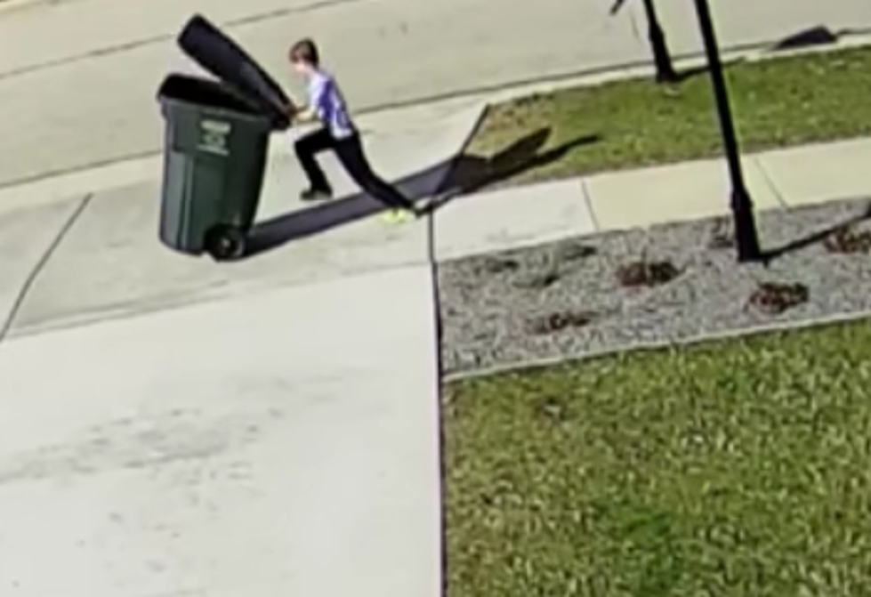 Kid Struggles To Take Out Garbage Due To Strong Winds [VIDEO]