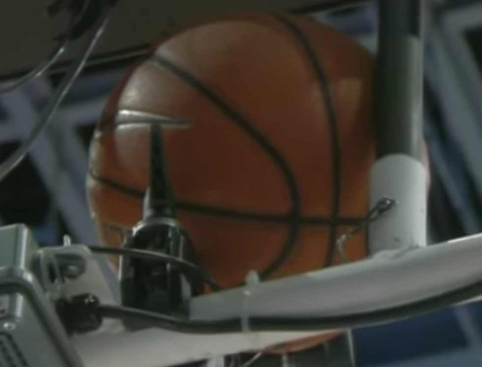 Young Kid Removes Basketball Stuck Behind Backboard [VIDEO]