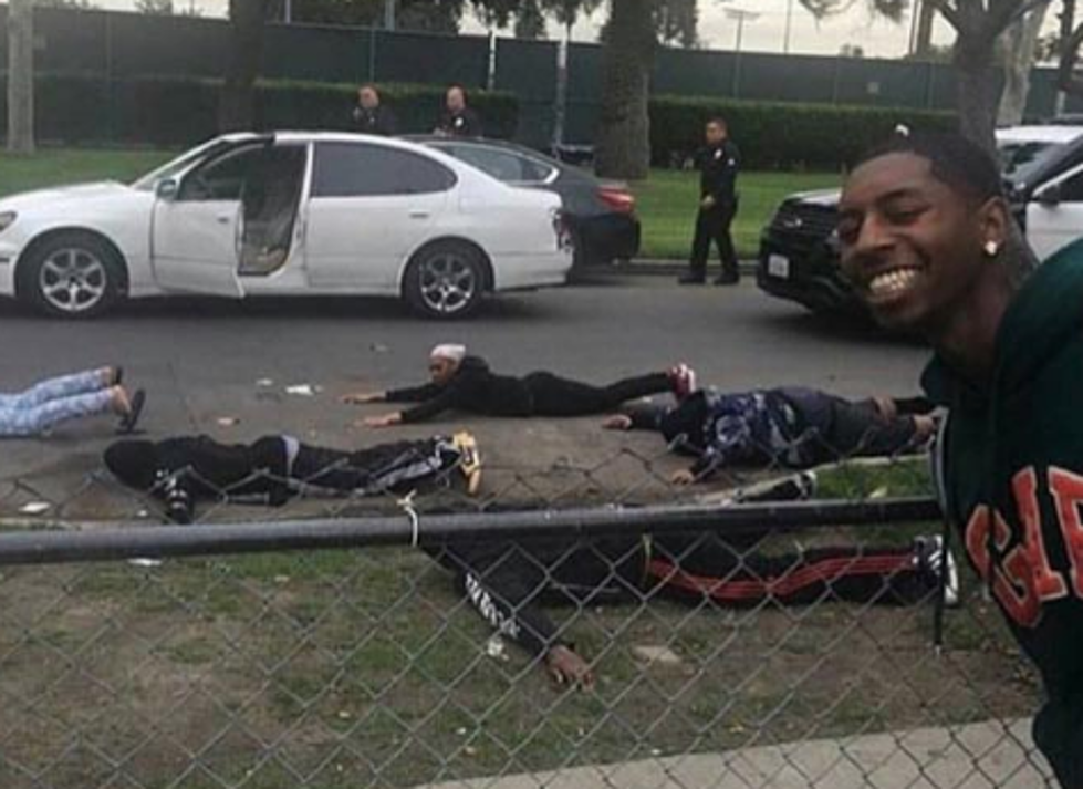 Man Is Way Too Happy To See Group Of People Getting Arrested [PHOTO]