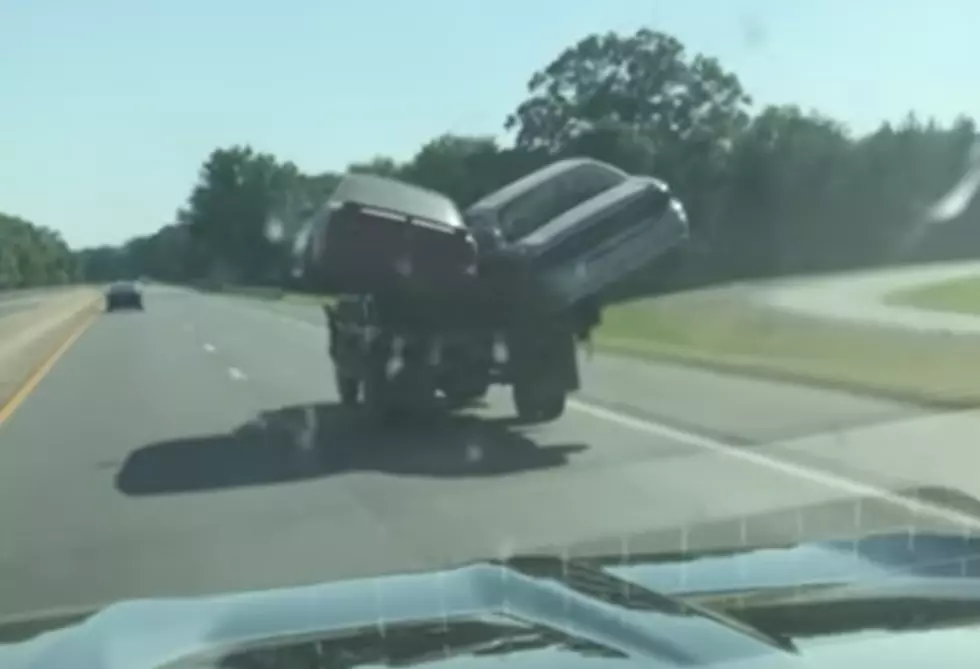 Pickup Truck Carries Two Cars Along Interstate [VIDEO]