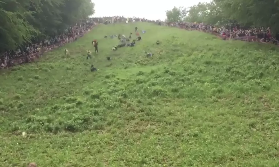 People Roll Down Hill At England Festival [VIDEO]