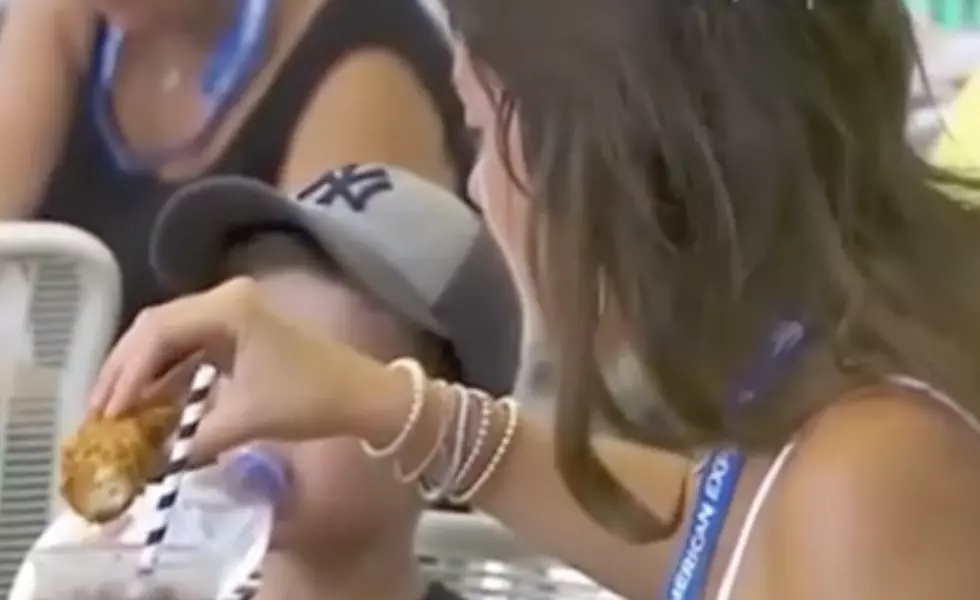 Woman Dips Chicken In Soft Drink While At U.S. Open [VIDEO]