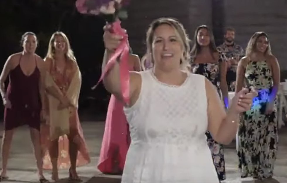 Bride Hits Kid In Head With Bouquet [VIDEO]