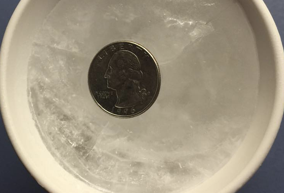 Why You Should Place A Quarter in A Frozen Cup Of Water During Freeze