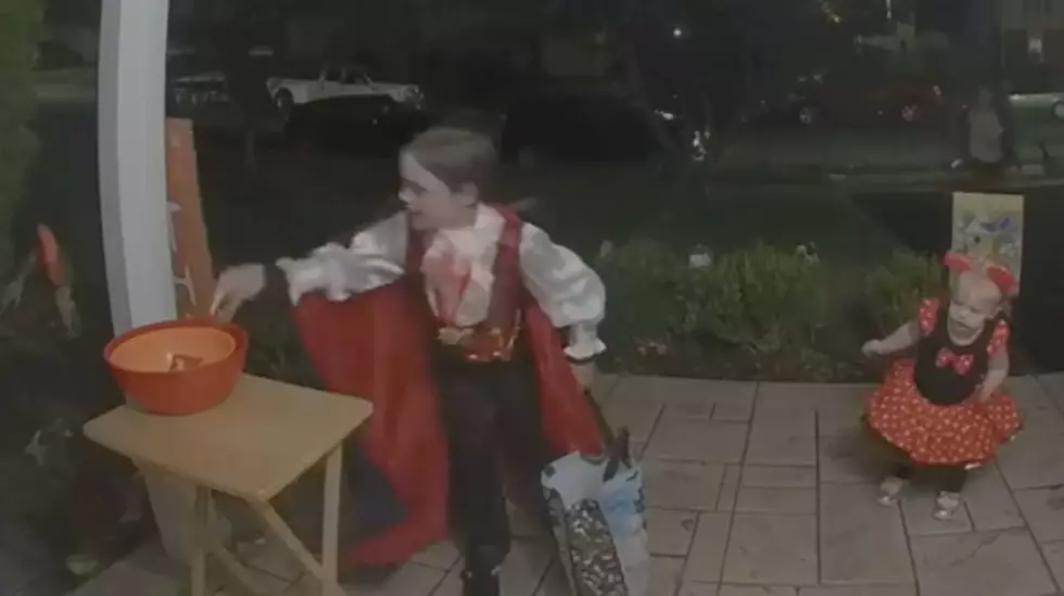 Little Boy Puts More Candy In Bucket For Halloween [VIDEO]