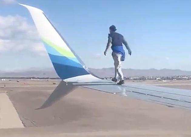 Man Climbs on Wing Of Plane Right Before Takeoff [VIDEO]
