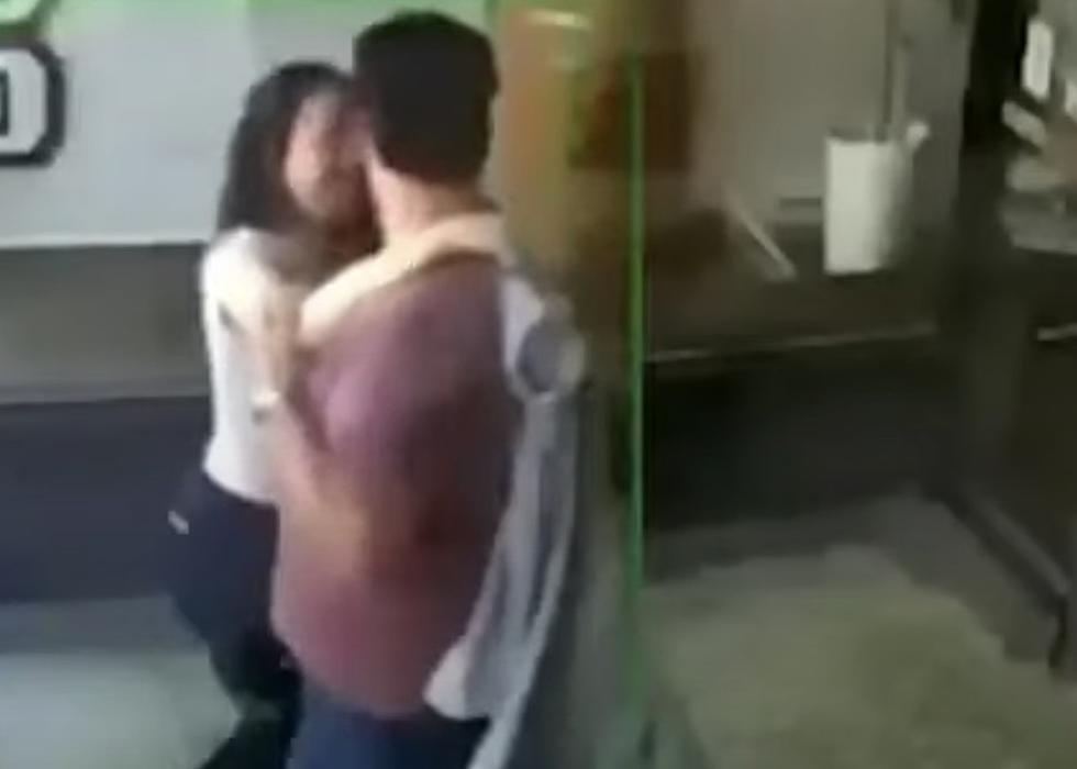 Kissing Couple Falls Through Glass Door of Barbershop [VIDEO]