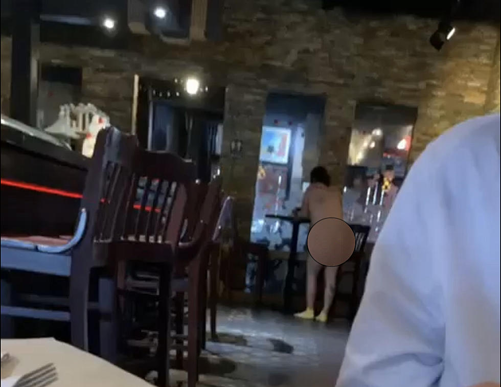 Naked Man Stands at the Bar in Lafayette Restaurant