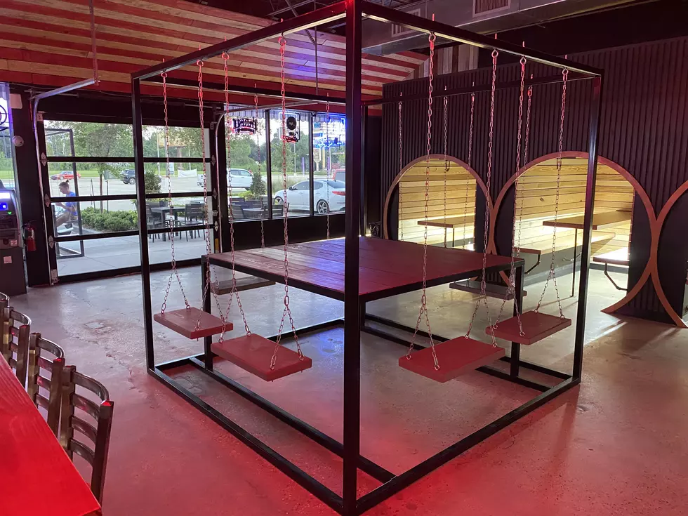 New Bar in Lafayette Creates Buzz With Swings Around Tables