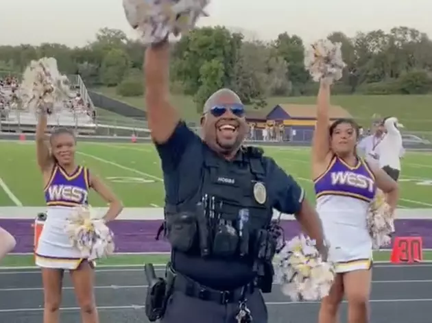 Police Officer Joins Cheerleaders on Sideline During High School Football Game [VIDEO]