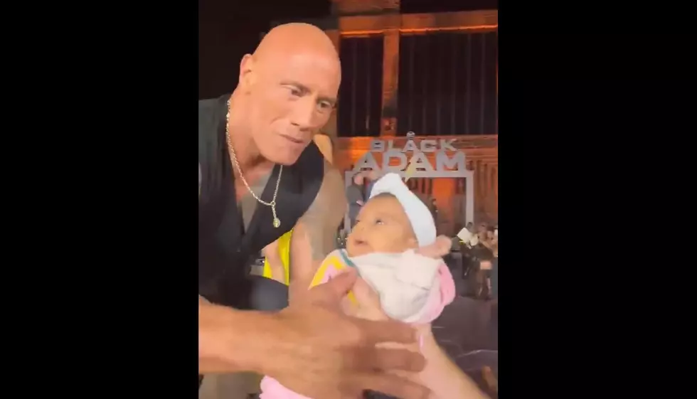 Internet Reacts to The Rock Holding a Crowd-Surfing Baby During Movie Tour