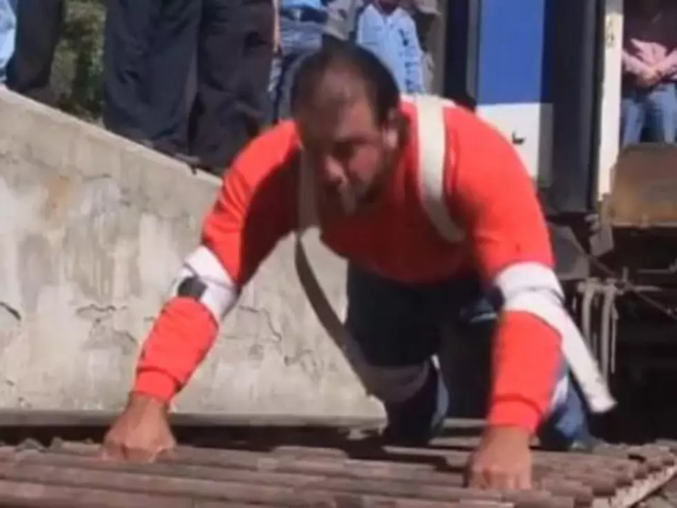 Strongman Pulls Train Weighing 2.5 Tons Up Incline [VIDEO]