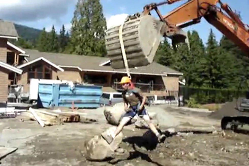 Man Takes Crazy Thrill Ride on Excavator