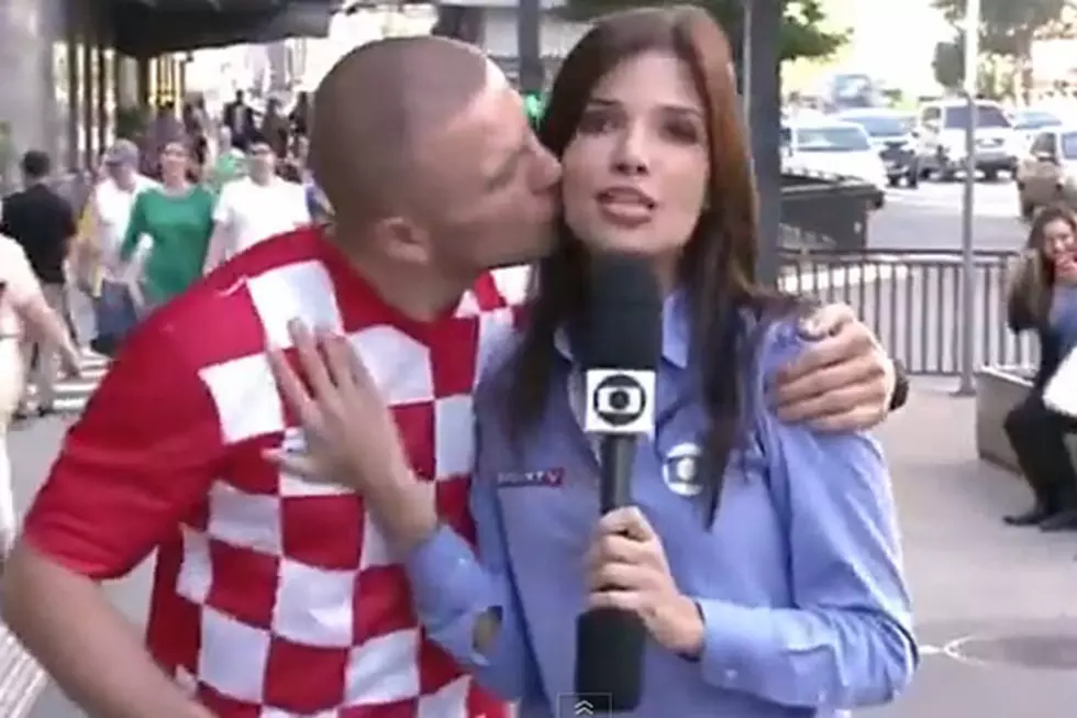 Smitten Soccer Fan Kisses Reporter During Live Report