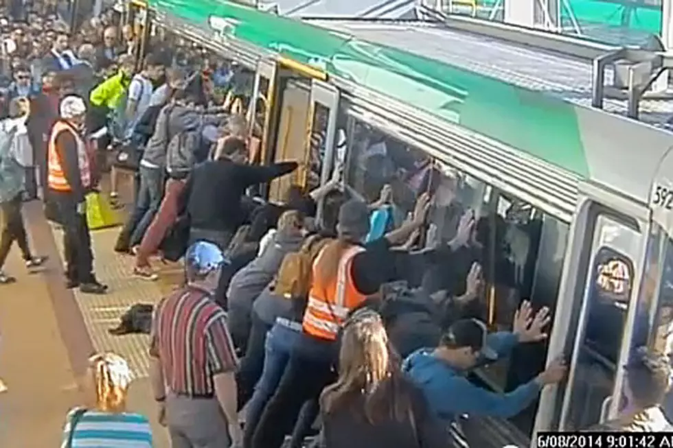 Commuters Move Train to Free Trapped Man