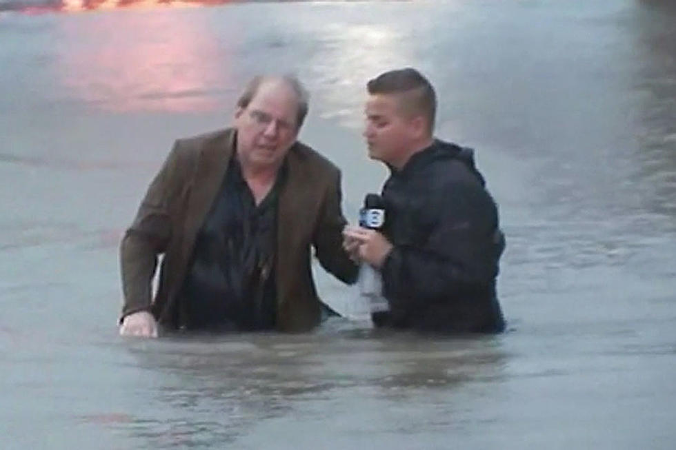 Watch an Irritated Reporter Save Confused Flooded Driver