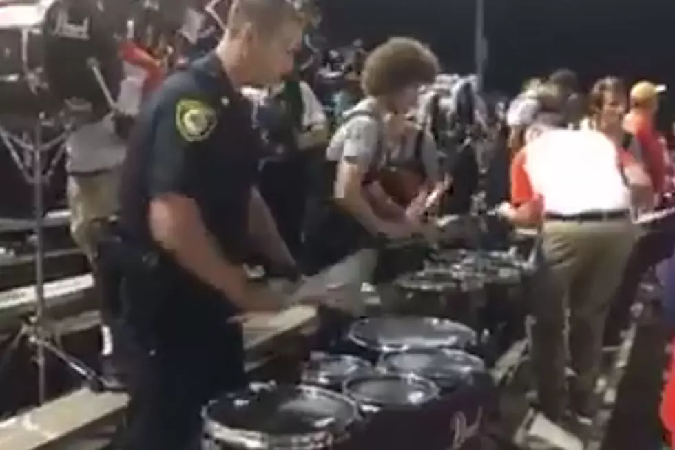 Police Officer Rocks the Drums With High School Band