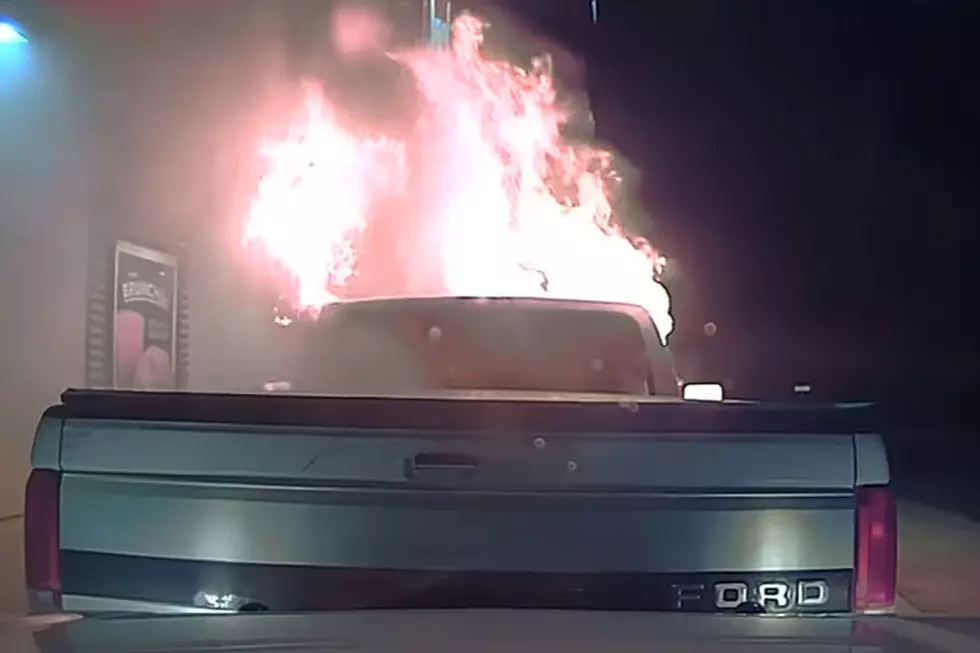 Cop Pushes Burning Car Away Before It Sets Restaurant Ablaze